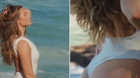 Paolla Oliveira posta vídeo de maiô branco na praia e descreve: "Brasileira, meu amor!"