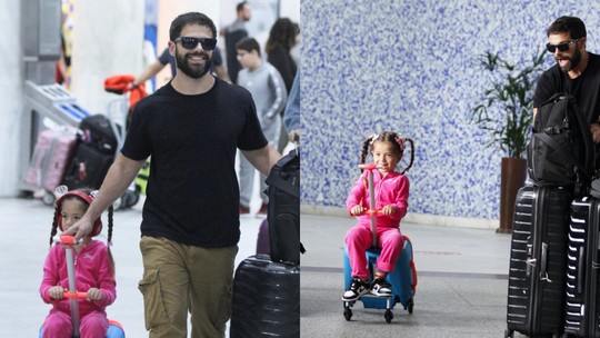 Zoe se diverte ao desembarcar no aeroporto acompanhada do pai, Duda Nagle; fotos