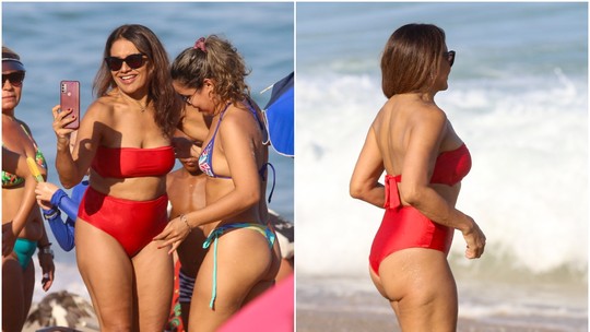 Dira Paes se refresca em praia do RJ com biquíni vermelho; fotos