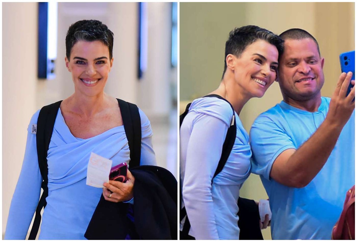 Reservada, Ana Paula Arósio sorri para paparazzo e atende pedido de