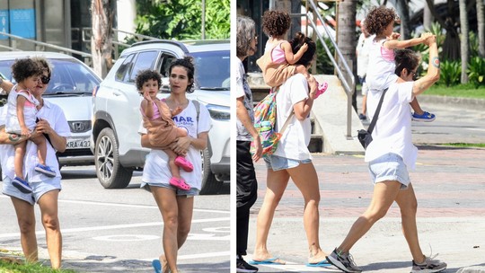 Nanda Costa e Lan Lanh carregam gêmeas nos ombros em passeio no Rio