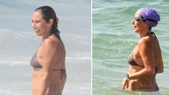 Andréa Beltrão curte dia de sol e se refresca em Copacabana